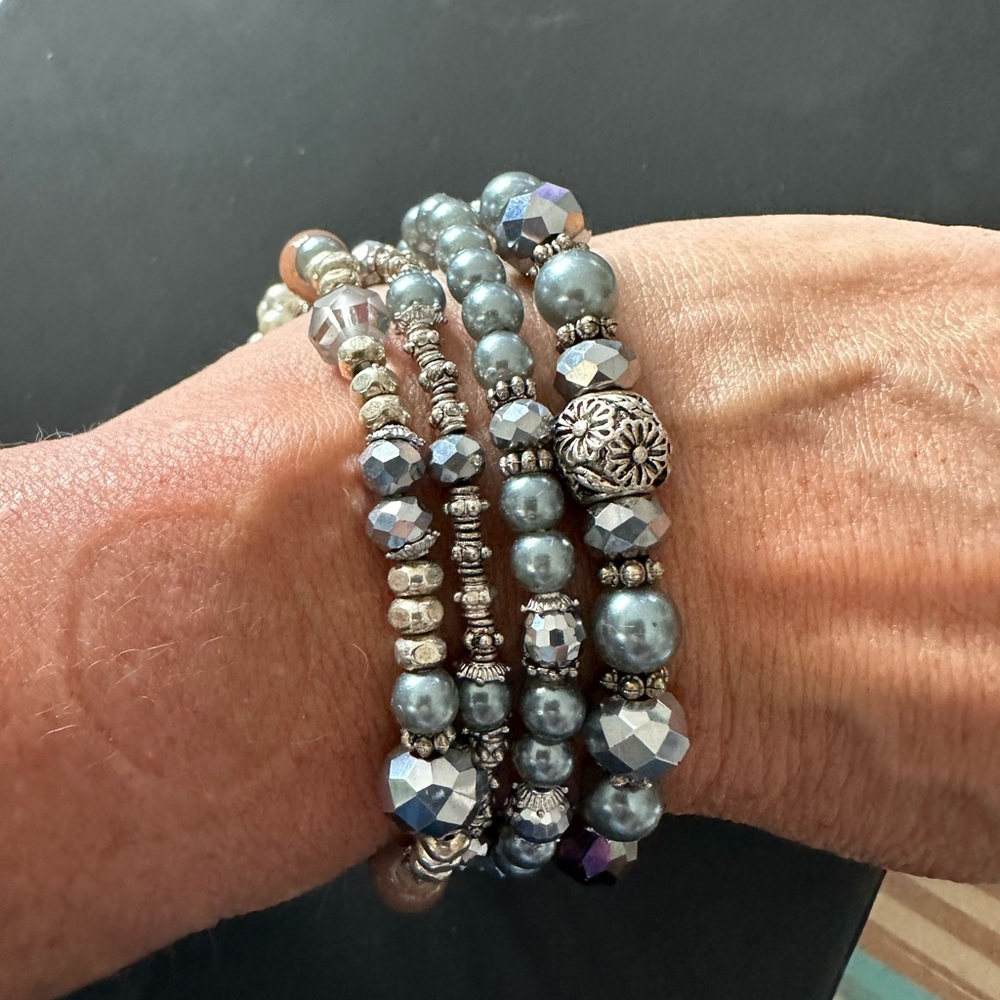 Four stretch bracelet set with charms